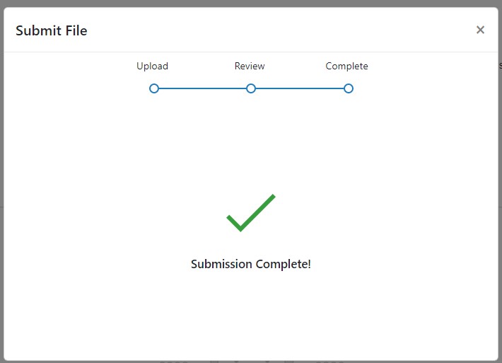 A screenshot of the Turnitin Submission Upload Window. A green tick is displayed on screen with the text ' Submission Complete'.